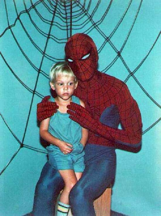 vintage-snapshot-kid-sitting-on-creepy-spider-mans-lap-funny-family-portraits